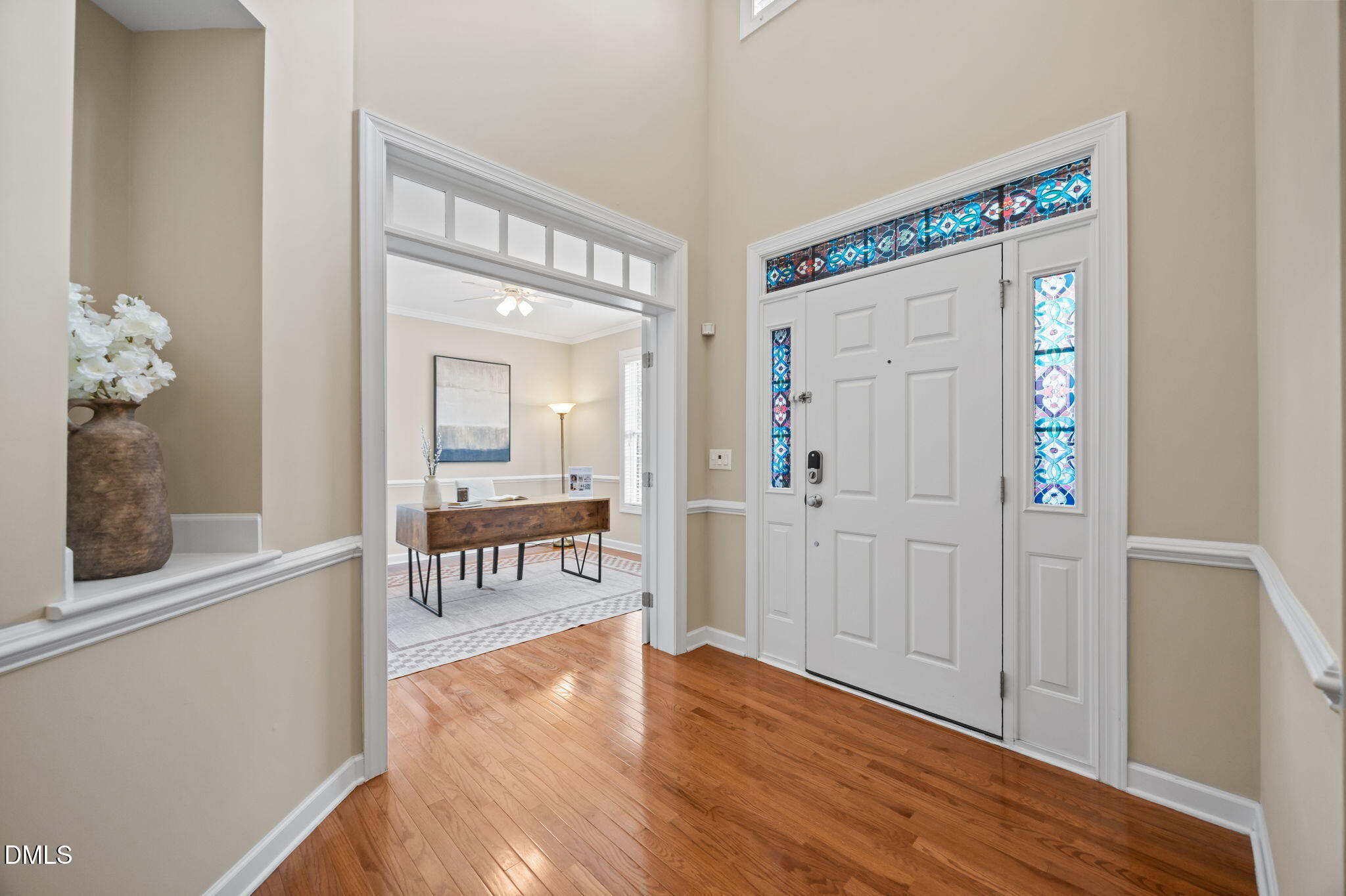 5309 Lyon Farm Drive Durham, NC 27713 - Photo 17 of 68 view of a hallway with wooden floor and a living room