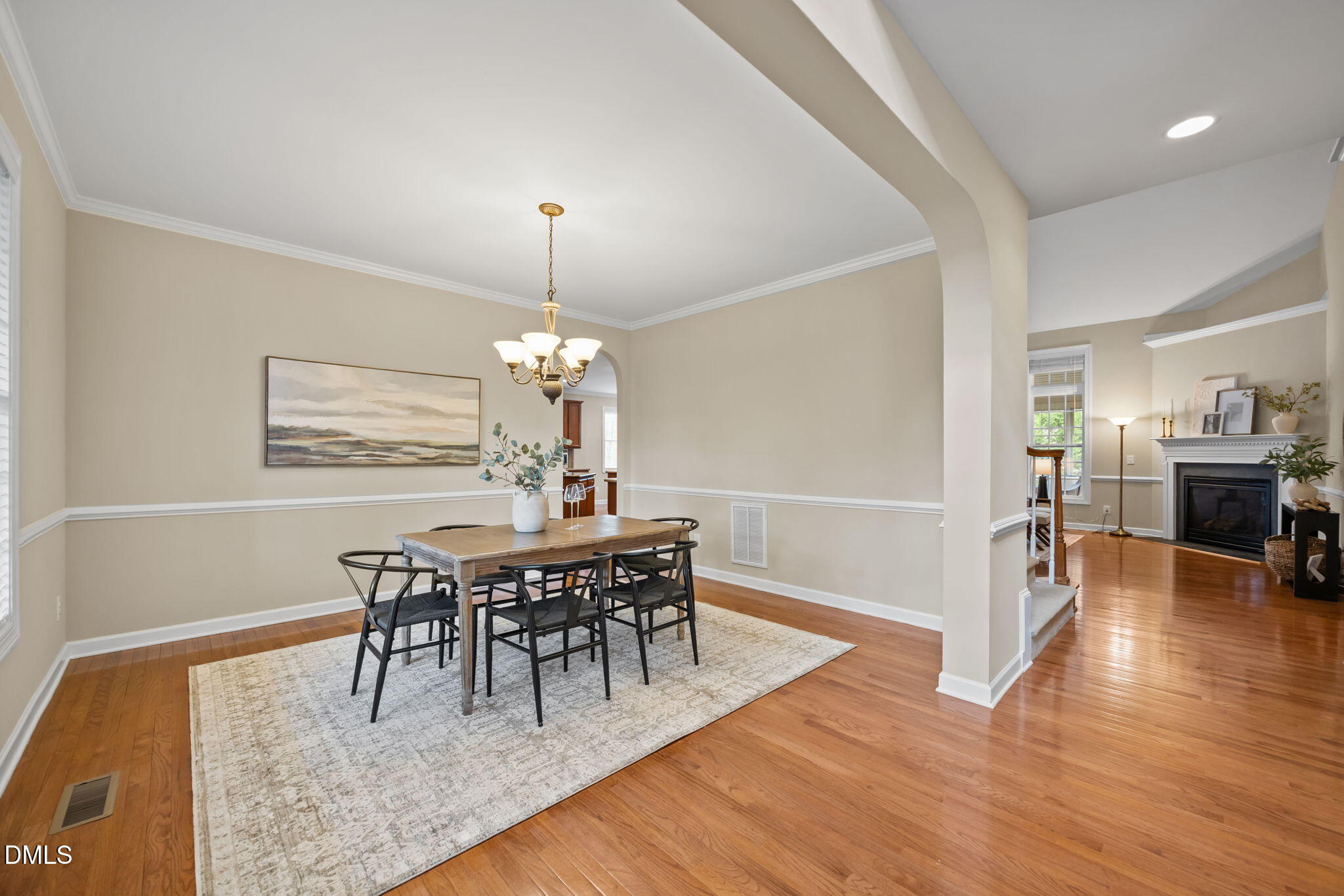 5309 Lyon Farm Drive Durham, NC 27713 - Photo 19 of 68 a view of a dining room with furniture and wooden floor