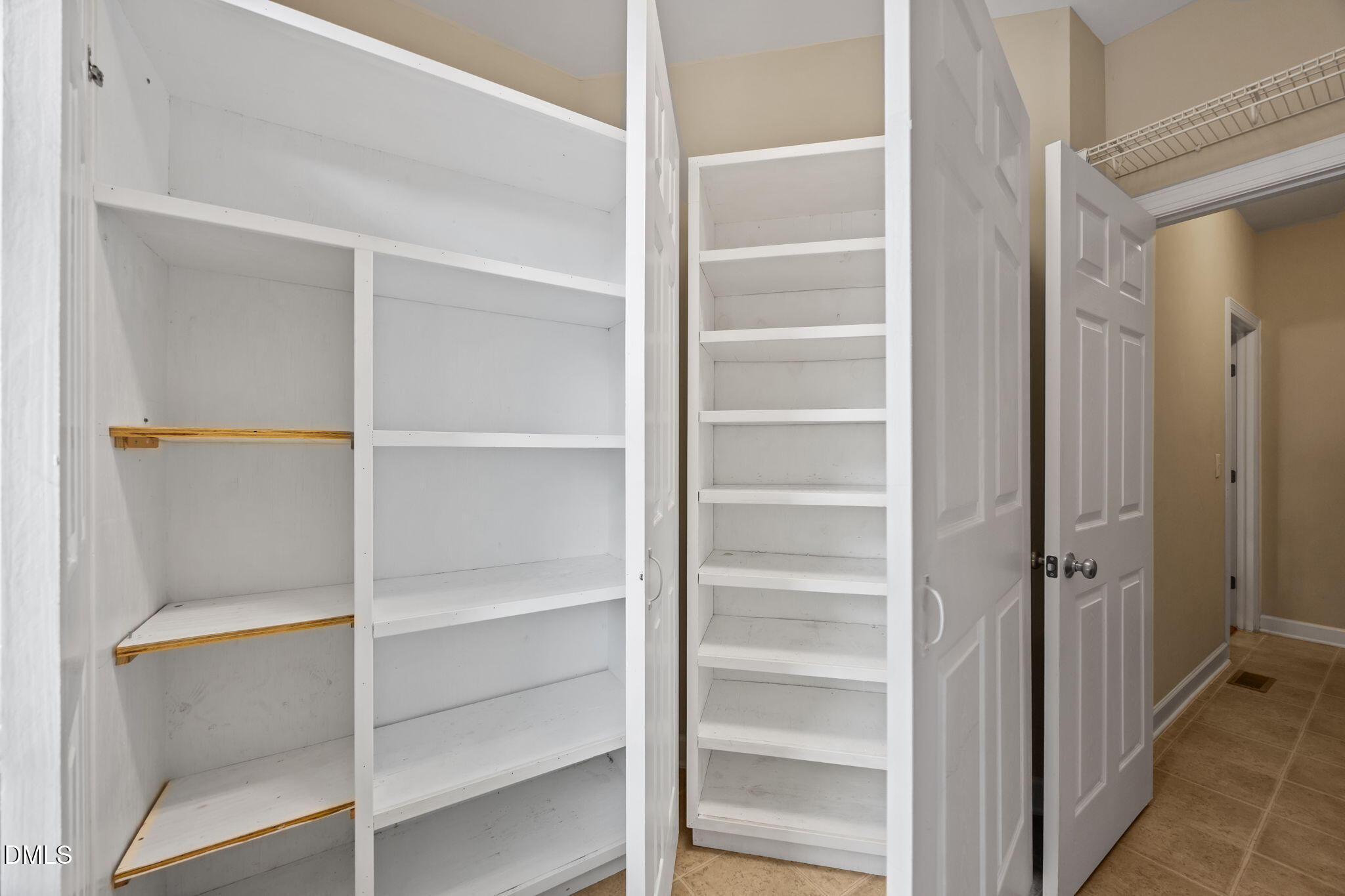 5309 Lyon Farm Drive Durham, NC 27713 - Photo 24 of 68 a view of walk in closet with empty racks