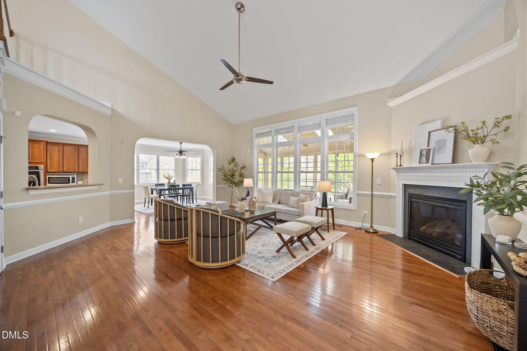 5309 Lyon Farm Drive Durham, NC 27713 - Photo 28 of 68 a living room with furniture a fireplace and a wooden floor