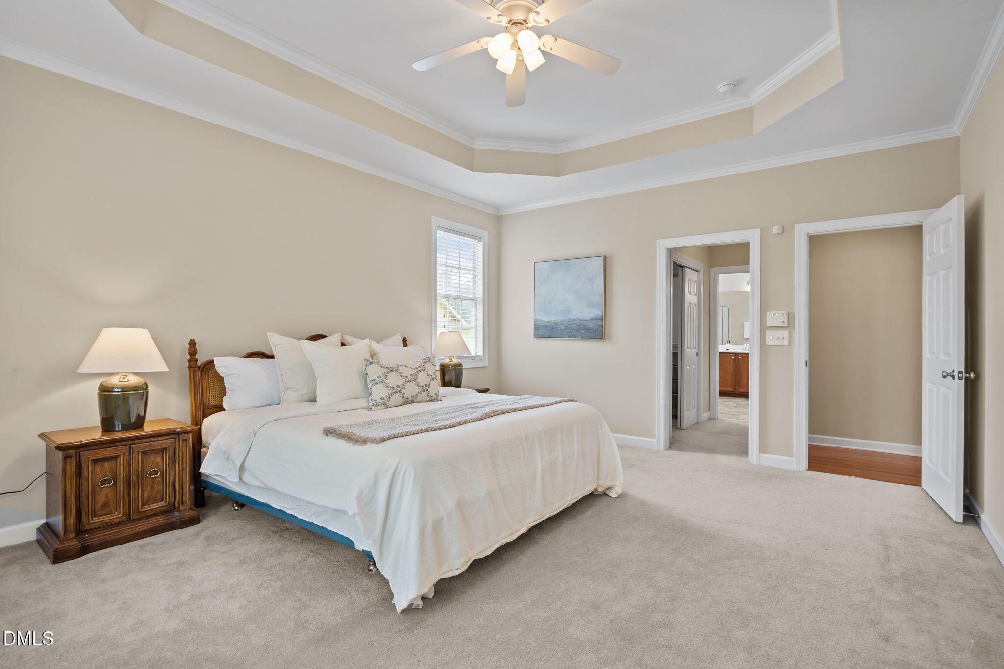 5309 Lyon Farm Drive Durham, NC 27713 - Photo 34 of 68 a bedroom with bed and a chandelier