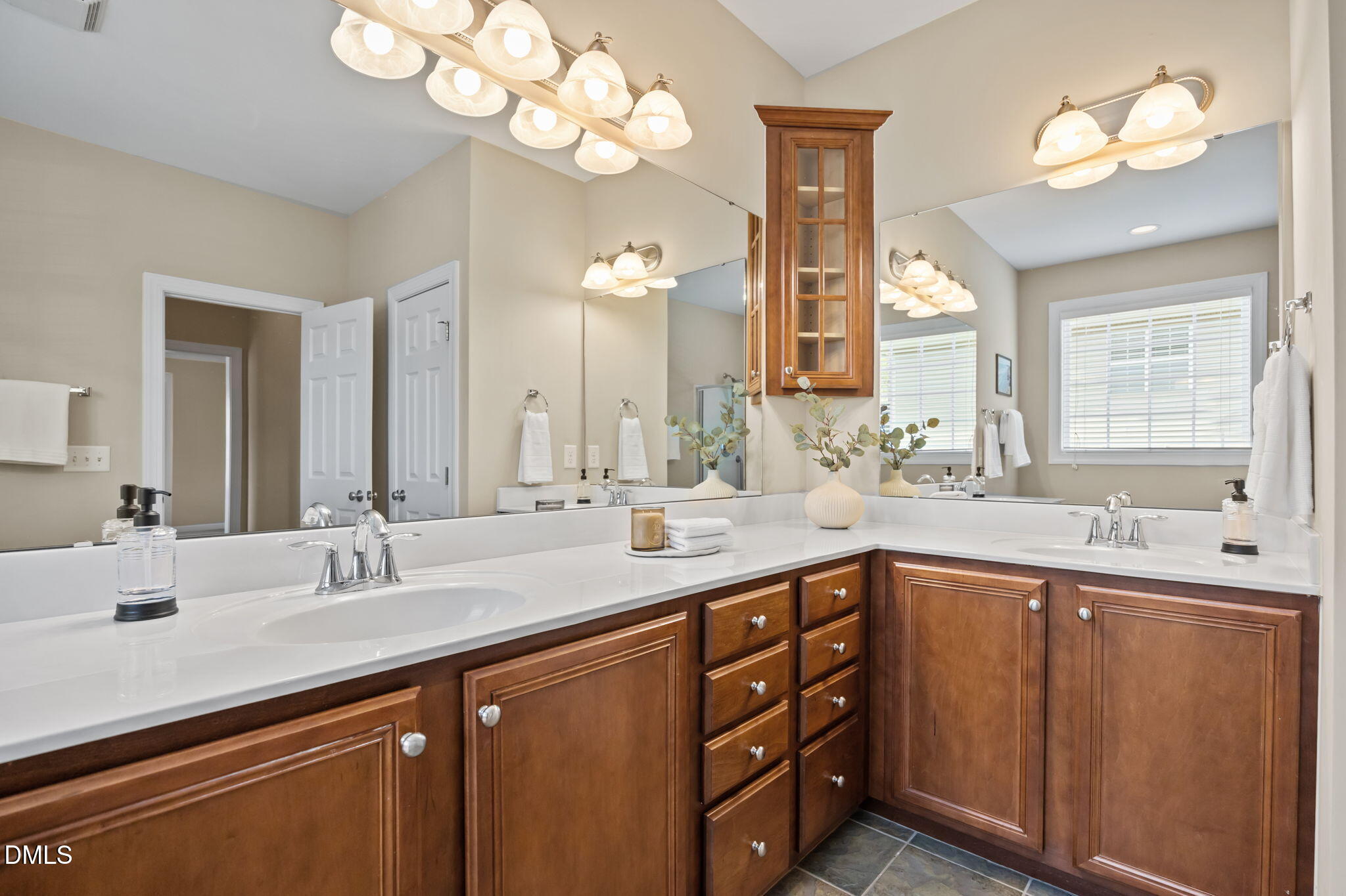 5309 Lyon Farm Drive Durham, NC 27713 - Photo 36 of 68 a bathroom with a sink a large mirror and a bathtub with a large mirror on the dresser