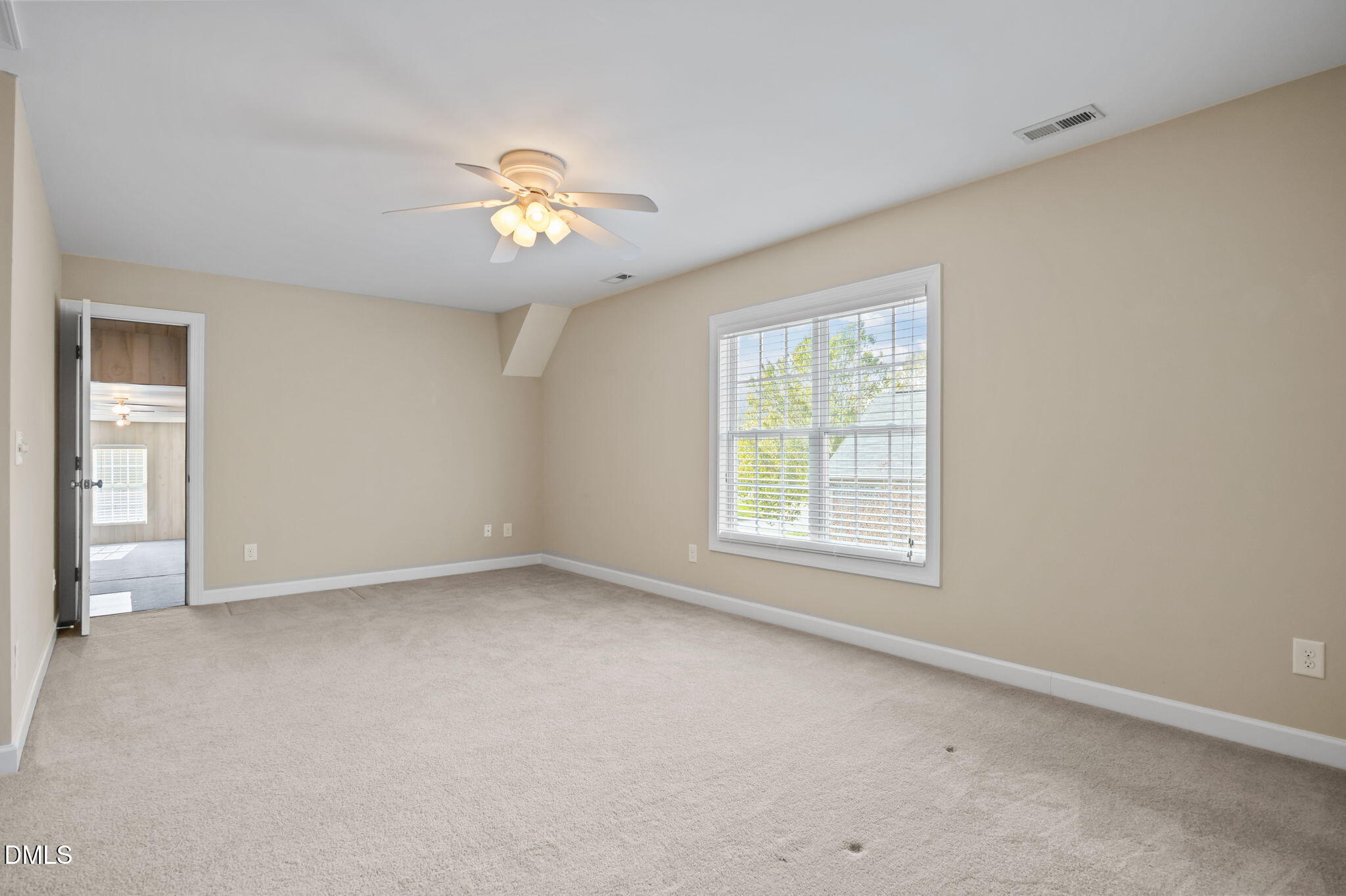 5309 Lyon Farm Drive Durham, NC 27713 - Photo 40 of 68 an empty room with a window and a fan