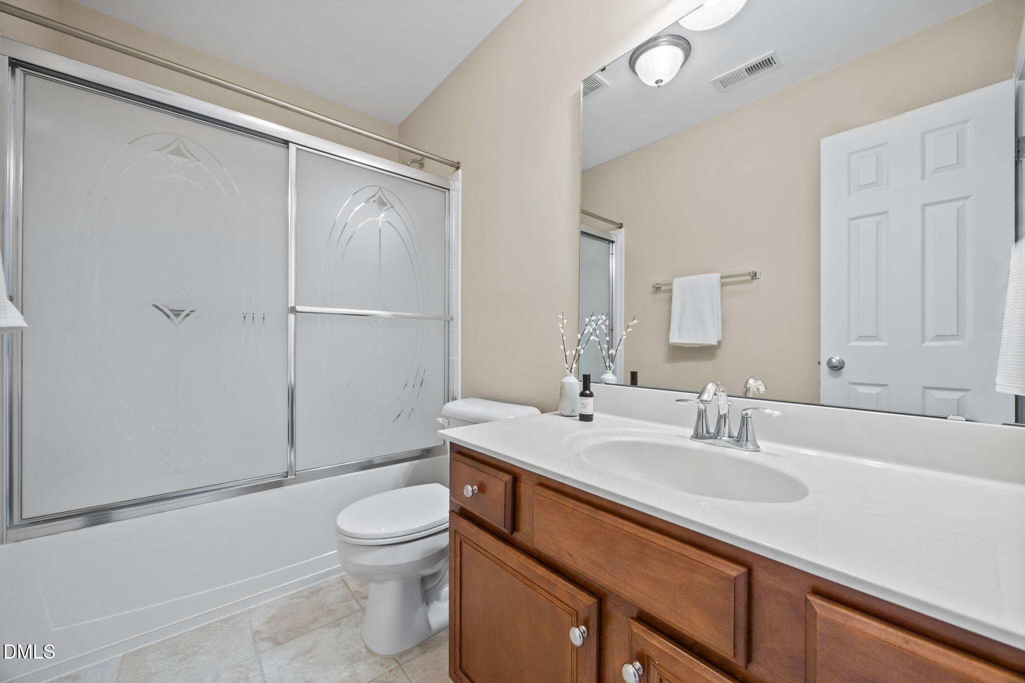 5309 Lyon Farm Drive Durham, NC 27713 - Photo 47 of 68 a bathroom with a sink a toilet and shower