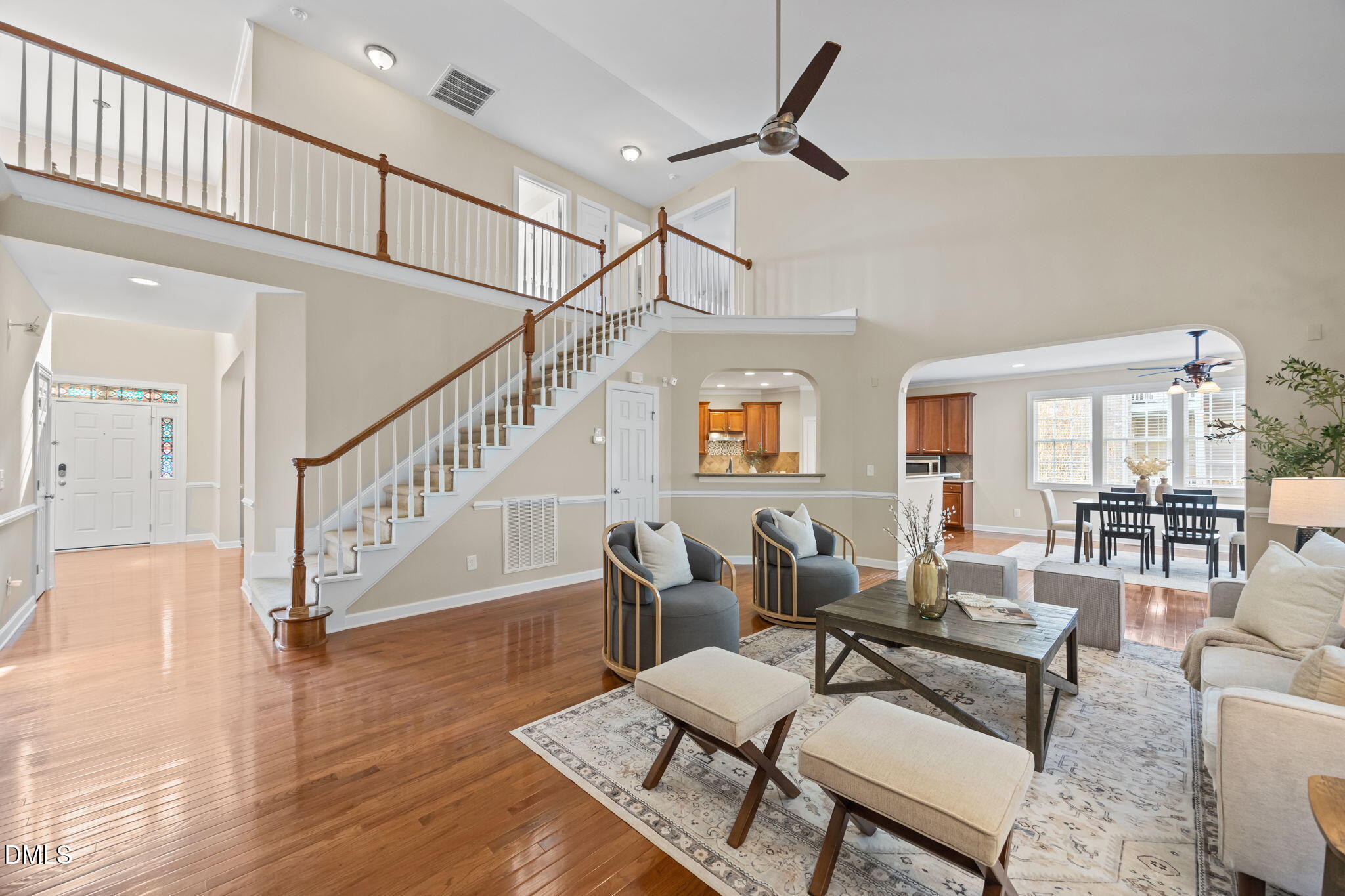 5309 Lyon Farm Drive Durham, NC 27713 - Photo 50 of 68 a living room with furniture or wooden floor and a ceiling fan