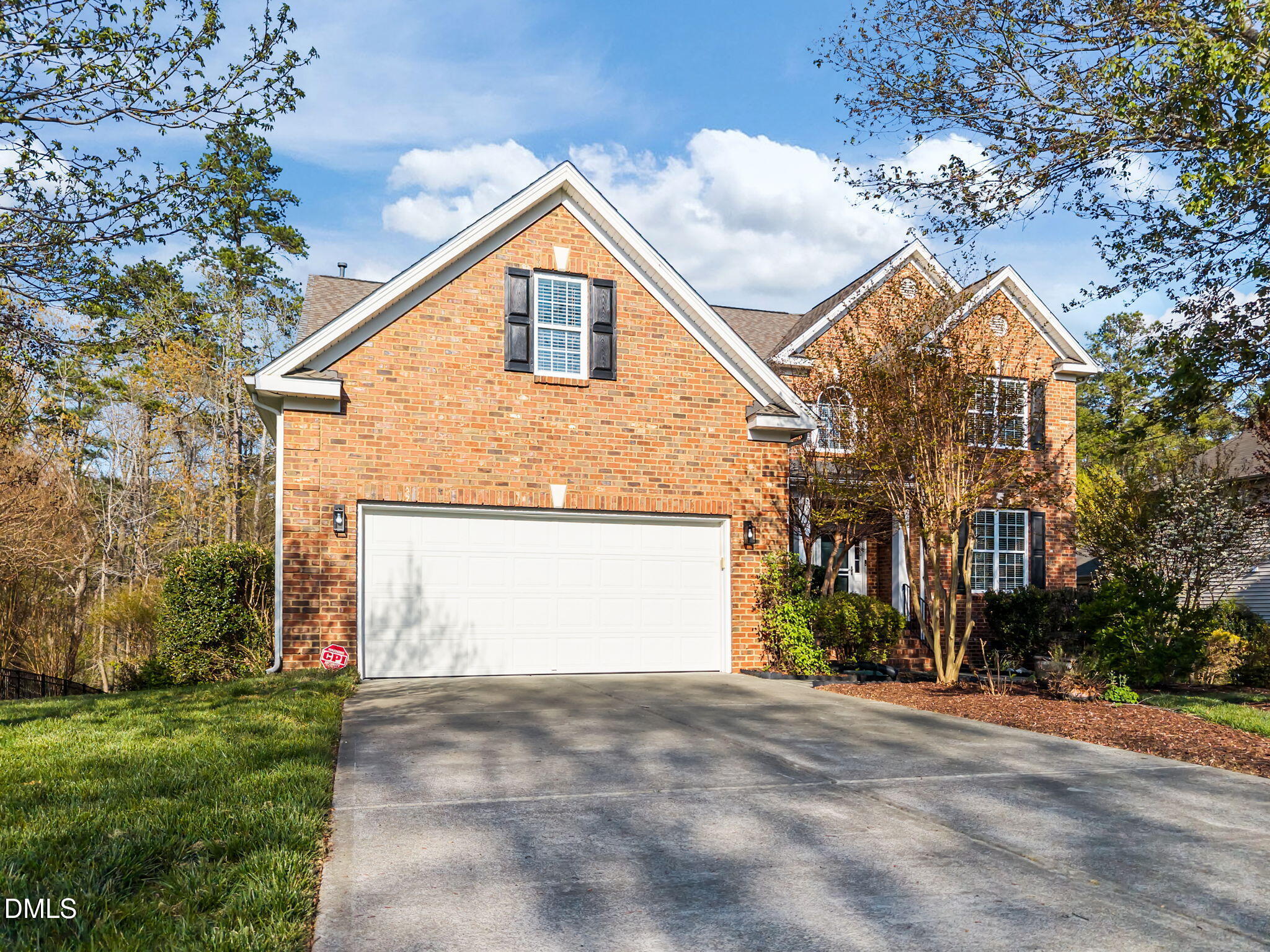 5309 Lyon Farm Drive Durham, NC 27713 - Photo 55 of 68 a view of a house with a yard and garage