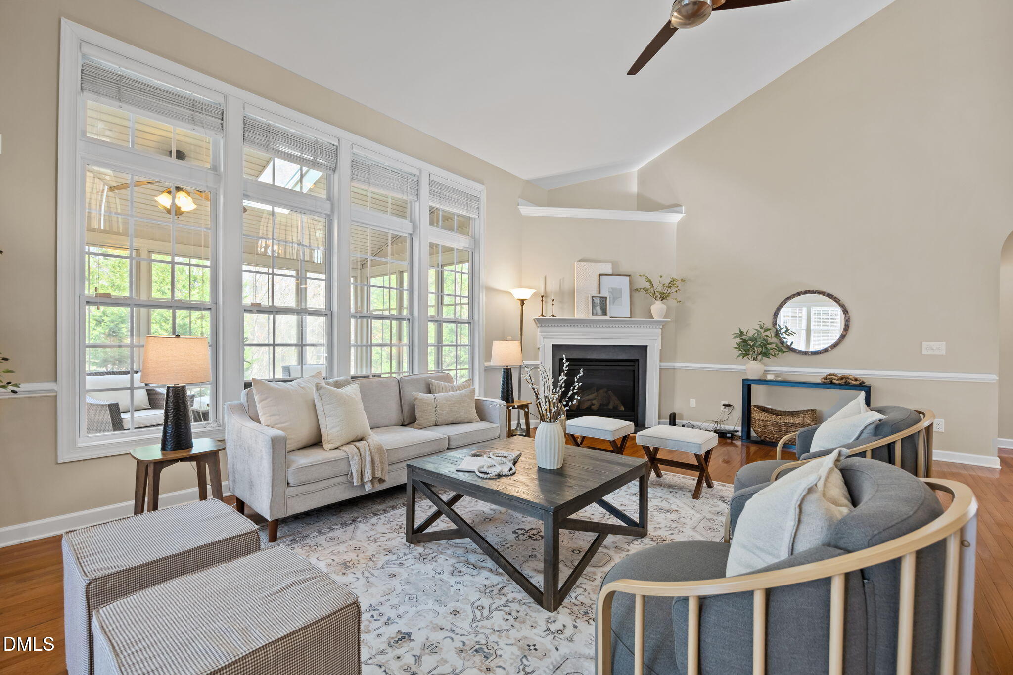 5309 Lyon Farm Drive Durham, NC 27713 - Photo 8 of 68 a living room with furniture a fireplace and a large window