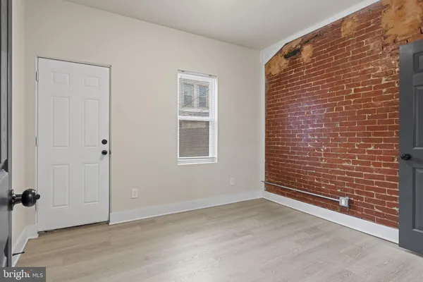 a view of an empty room with windows