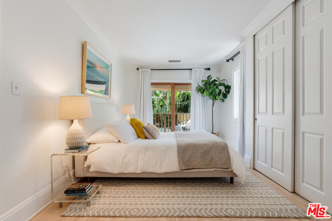 9044 Lloyd Place West Hollywood, CA 90069 - Photo 18 of 35 a bedroom with a bed and a window