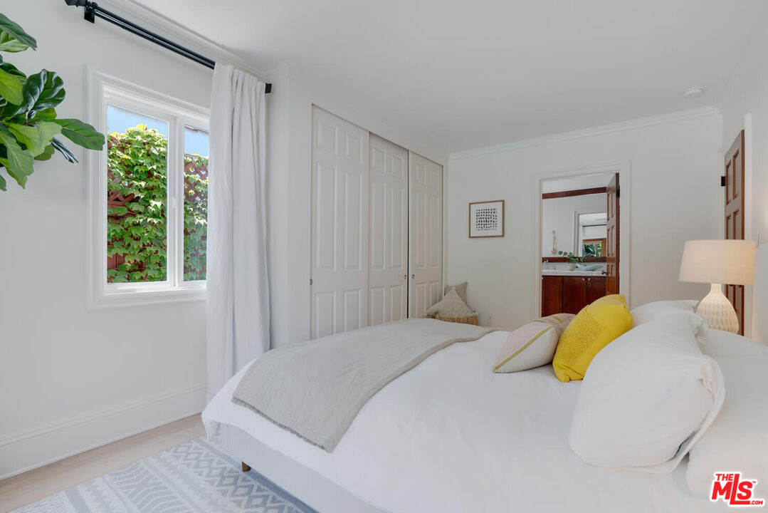 9044 Lloyd Place West Hollywood, CA 90069 - Photo 19 of 35 a bedroom with a bed and a window