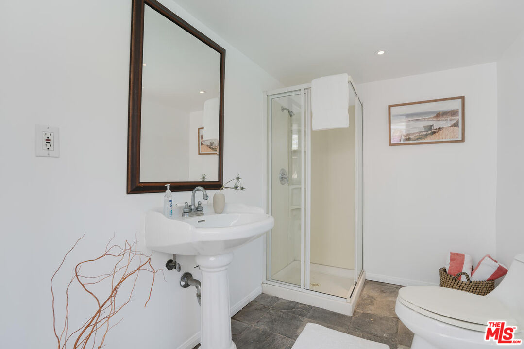 9044 Lloyd Place West Hollywood, CA 90069 - Photo 25 of 35 a bathroom with a sink toilet and shower