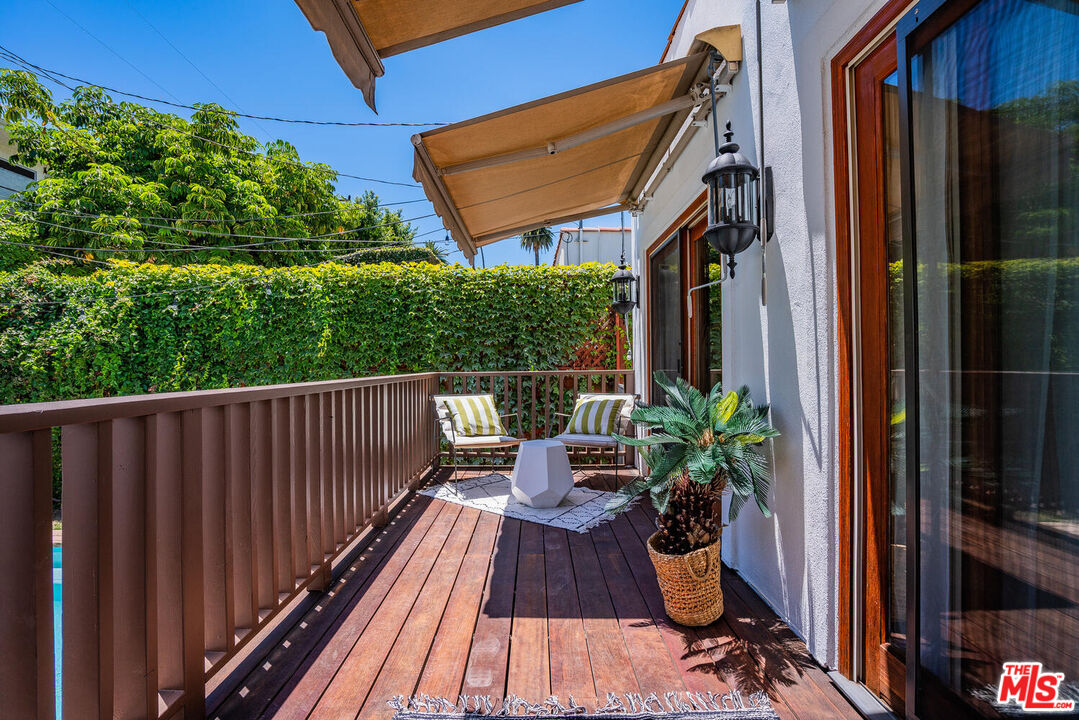 9044 Lloyd Place West Hollywood, CA 90069 - Photo 26 of 35 a view of balcony with chairs and wooden fence