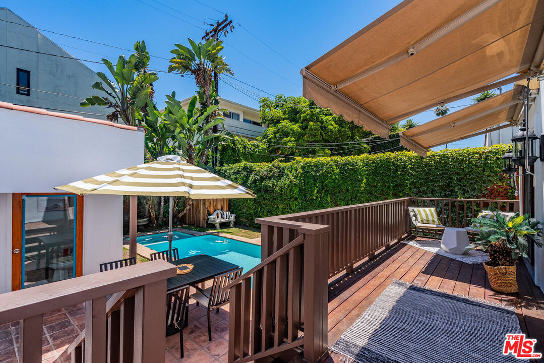 9044 Lloyd Place West Hollywood, CA 90069 - Photo 27 of 35 a view of a patio with furniture and a yard