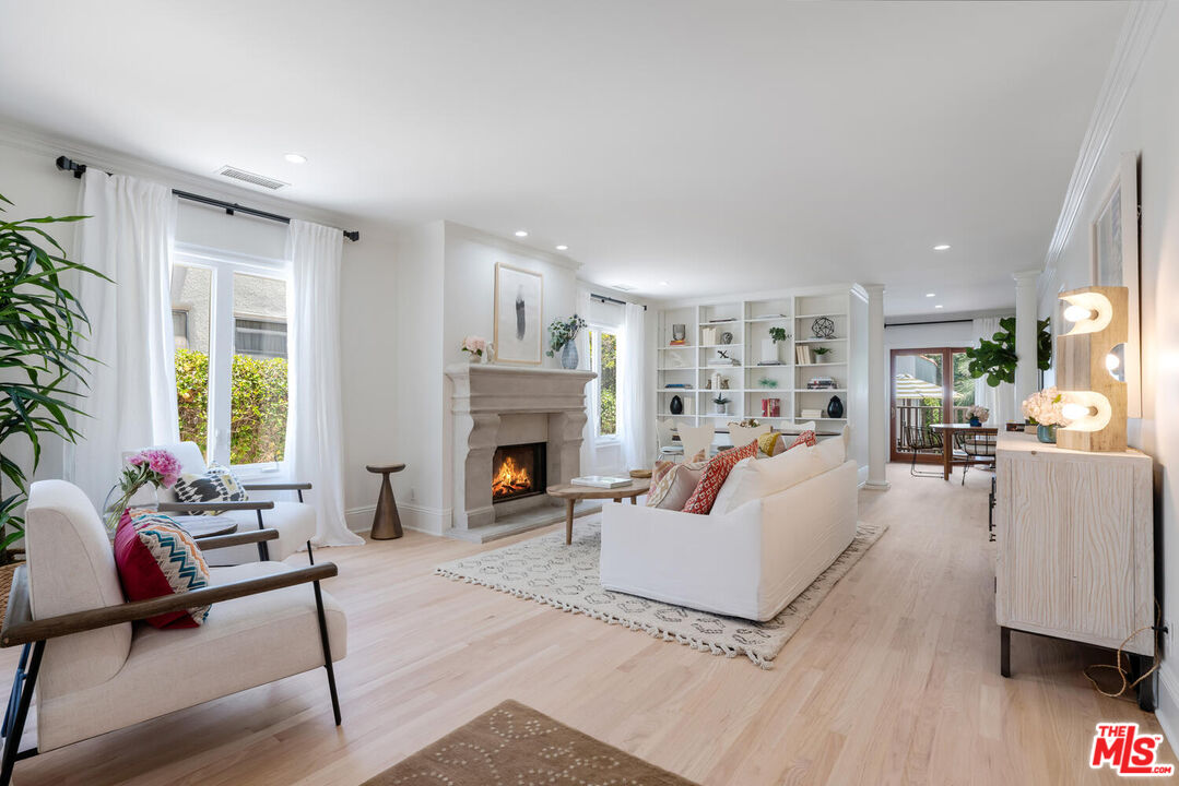9044 Lloyd Place West Hollywood, CA 90069 - Photo 5 of 35 a living room with furniture and a fireplace