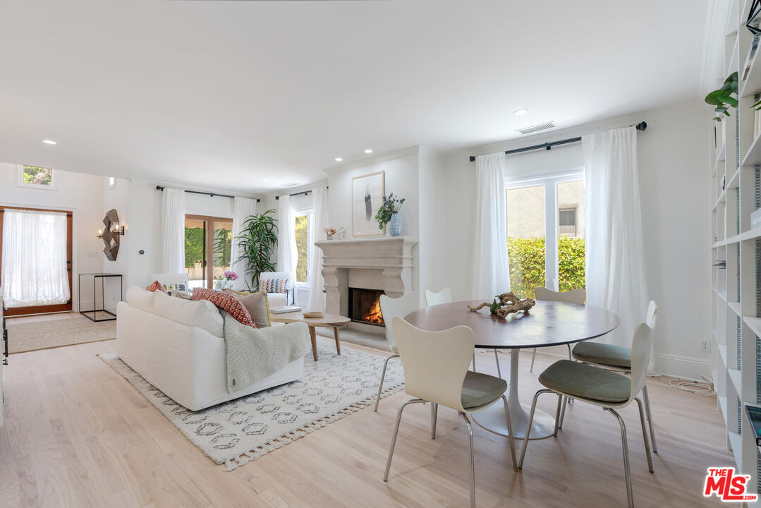 9044 Lloyd Place West Hollywood, CA 90069 - Photo 7 of 35 a living room with furniture and a fireplace