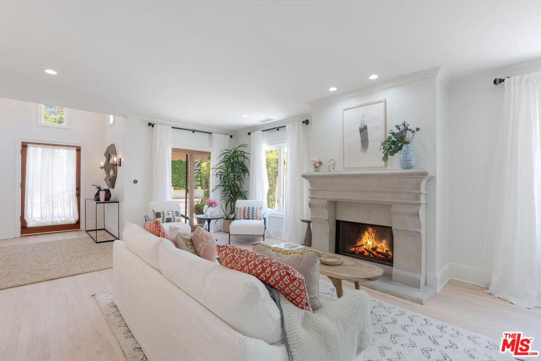 9044 Lloyd Place West Hollywood, CA 90069 - Photo 10 of 35 a living room with furniture fireplace and window