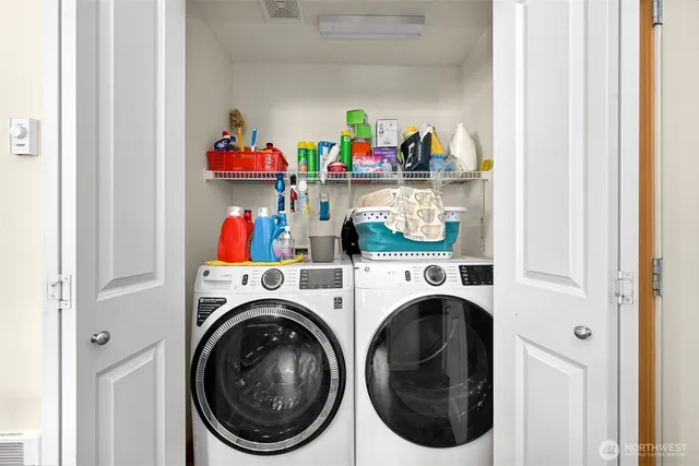 a utility room with dryer and washer