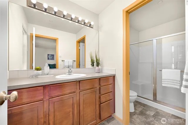 a bathroom with a double vanity sink and a mirror