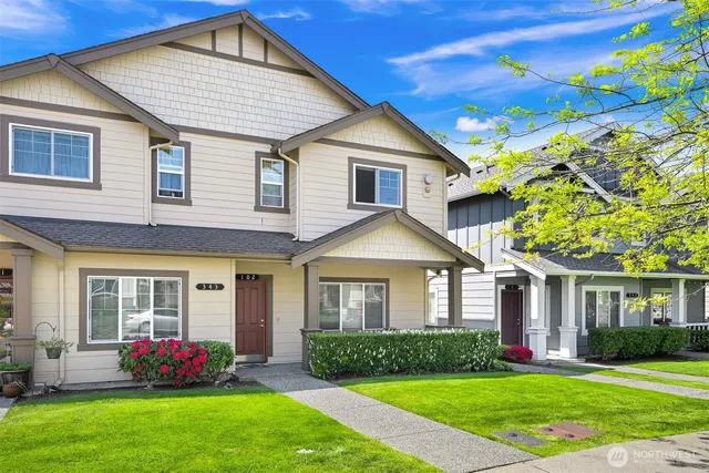 a front view of a house with a yard