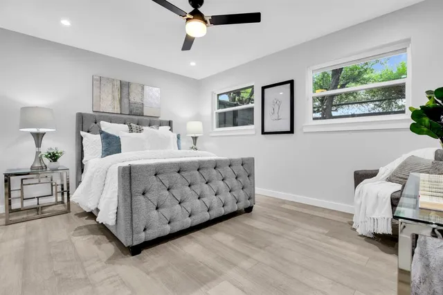 a bedroom with a bed and a window