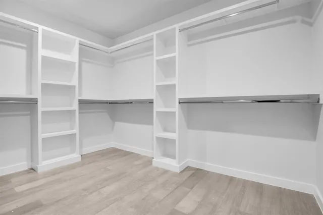 a view of an empty walk in closet