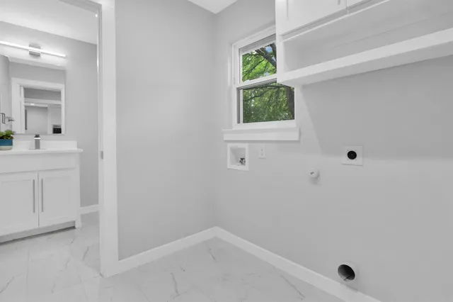 a view of room with a window and a bathroom