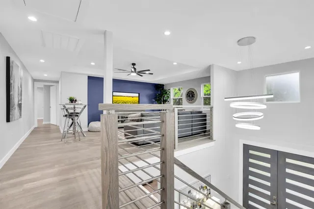 a view of a kitchen with furniture and appliances