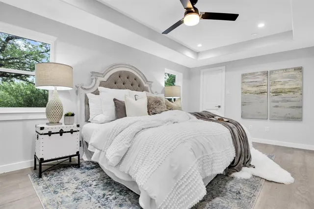 a bedroom with bed and a window