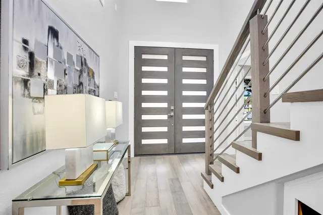 a view of a balcony with furniture and staircase