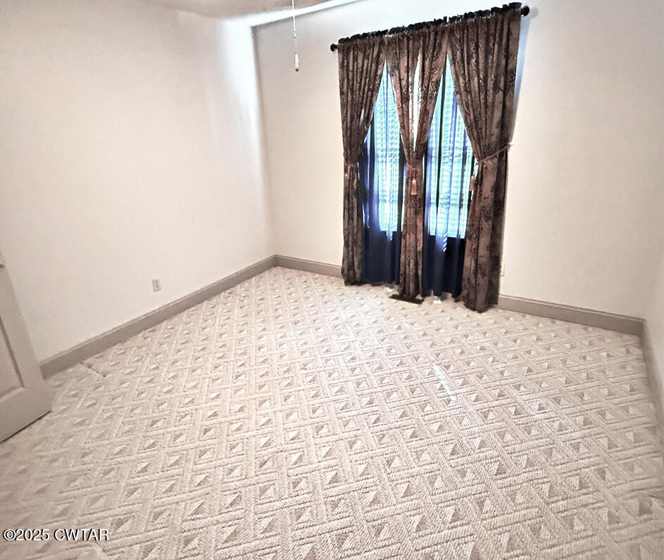 153 Timber Ridge Drive Lexington, TN 38351 - Photo 11 of 29 an empty room with windows