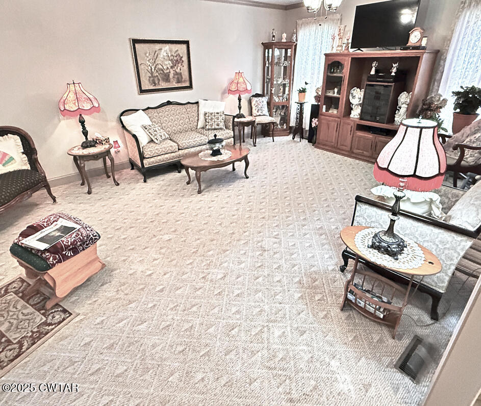 153 Timber Ridge Drive Lexington, TN 38351 - Photo 13 of 29 a living room with furniture and a flat screen tv