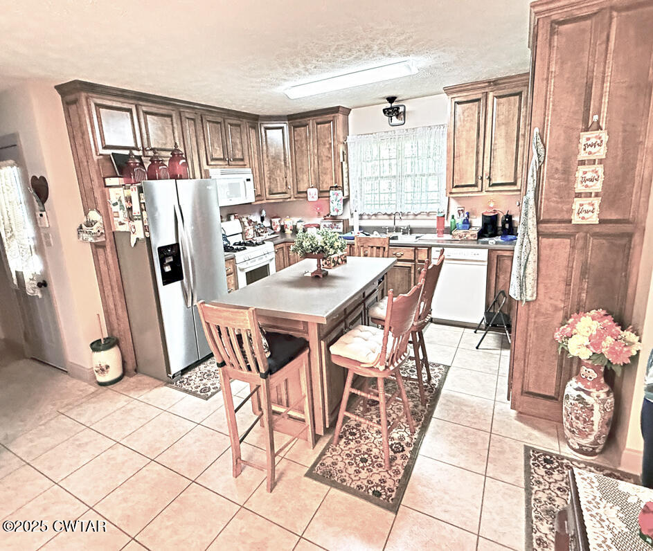 153 Timber Ridge Drive Lexington, TN 38351 - Photo 15 of 29 a view of a dining room with furniture and a window