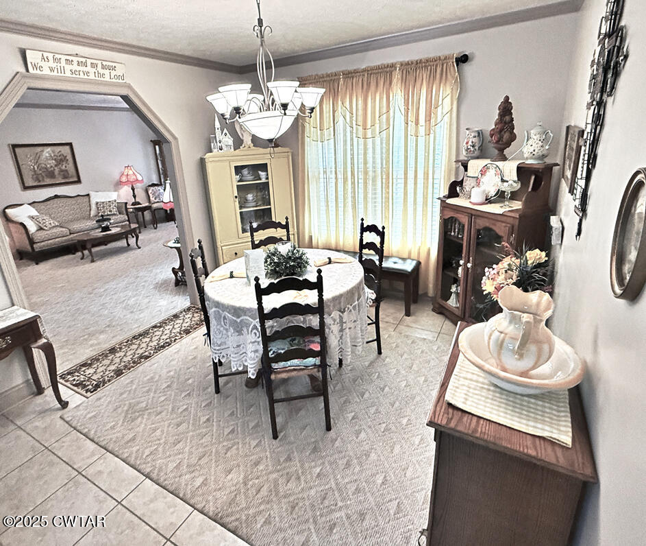 153 Timber Ridge Drive Lexington, TN 38351 - Photo 16 of 29 a dining room with furniture and window