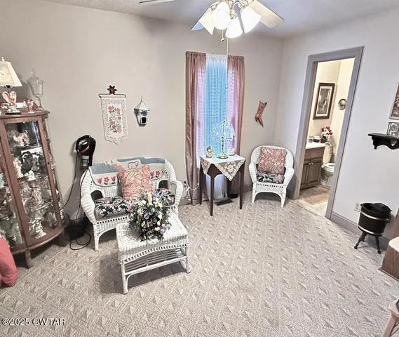 a bedroom with furniture and a wooden floor