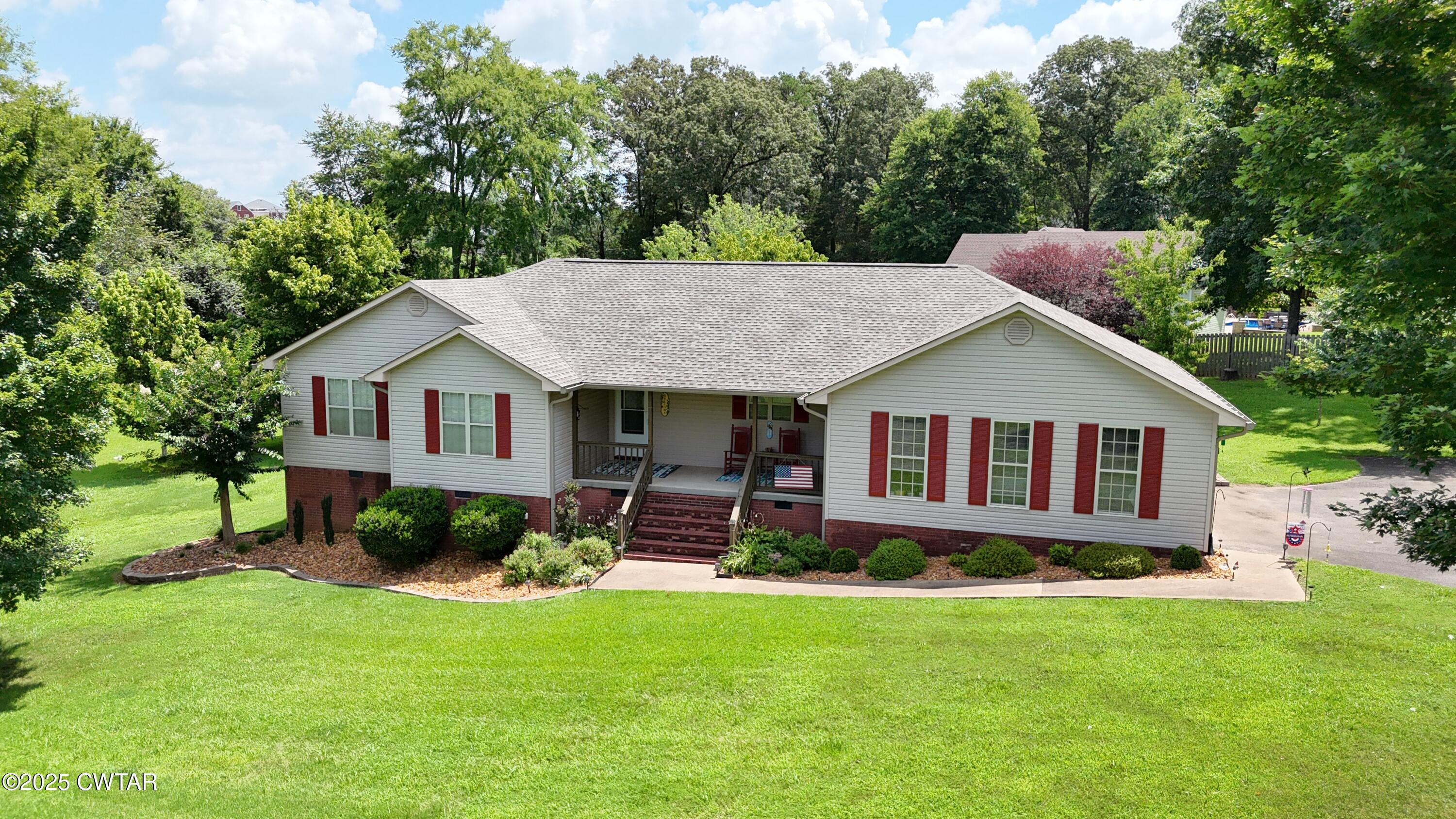 153 Timber Ridge Drive Lexington, TN 38351 - Photo 26 of 29 a view of a house with a yard and large tree