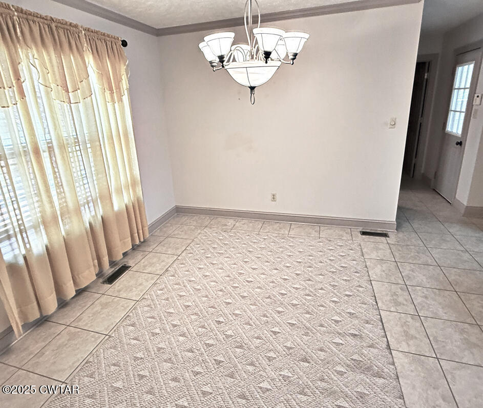 153 Timber Ridge Drive Lexington, TN 38351 - Photo 5 of 29 a view of an empty room with a window