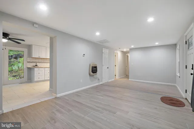 a kitchen with granite countertop a stove and a microwave