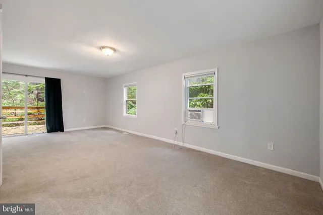 a bathroom with a granite countertop sink a shower and a mirror