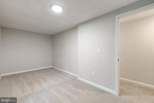 a backyard of a house with large trees