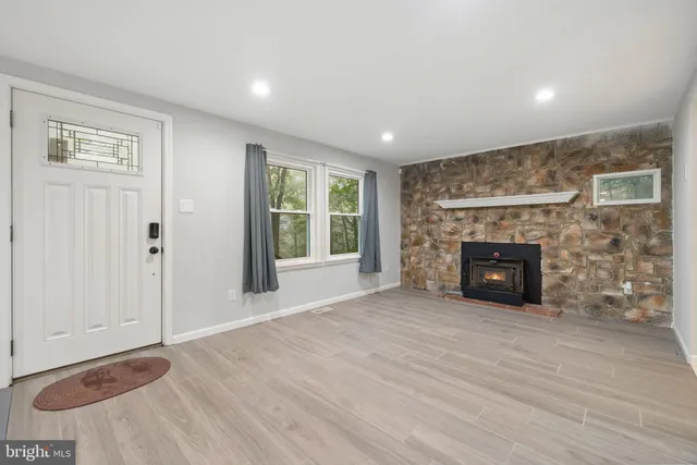 a big room with closet and fireplace