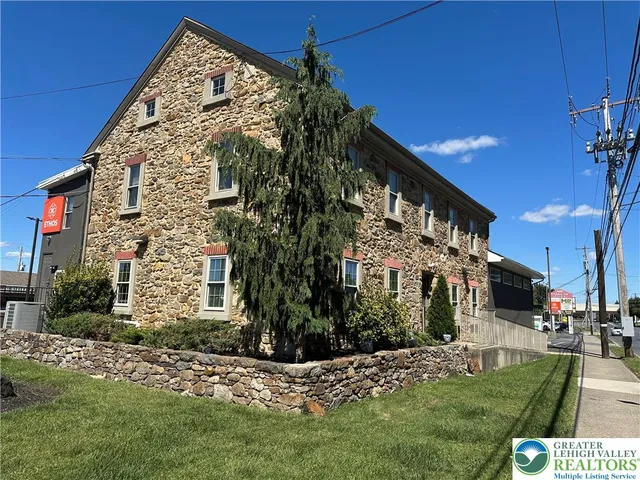 a view of a building with a yard