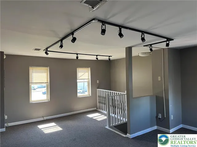 a view of a hallway with windows