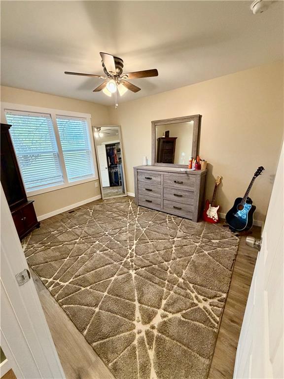 525 Wildcat Bridge Road Royston, GA 30662 - Photo 15 of 26 a bedroom with a bed and a mirror on the dresser