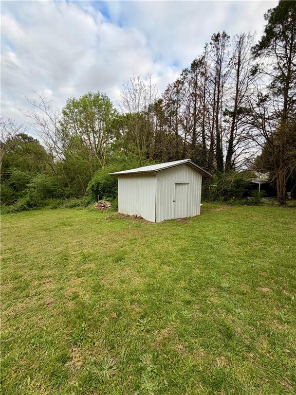 525 Wildcat Bridge Road Royston, GA 30662 - Photo 24 of 26 a view of a backyard with large trees