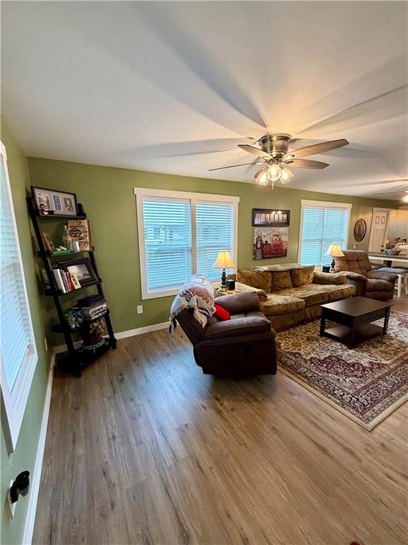 525 Wildcat Bridge Road Royston, GA 30662 - Photo 6 of 26 a living room with furniture and a flat screen tv