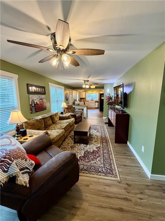 525 Wildcat Bridge Road Royston, GA 30662 - Photo 7 of 26 a living room with furniture and a chandelier