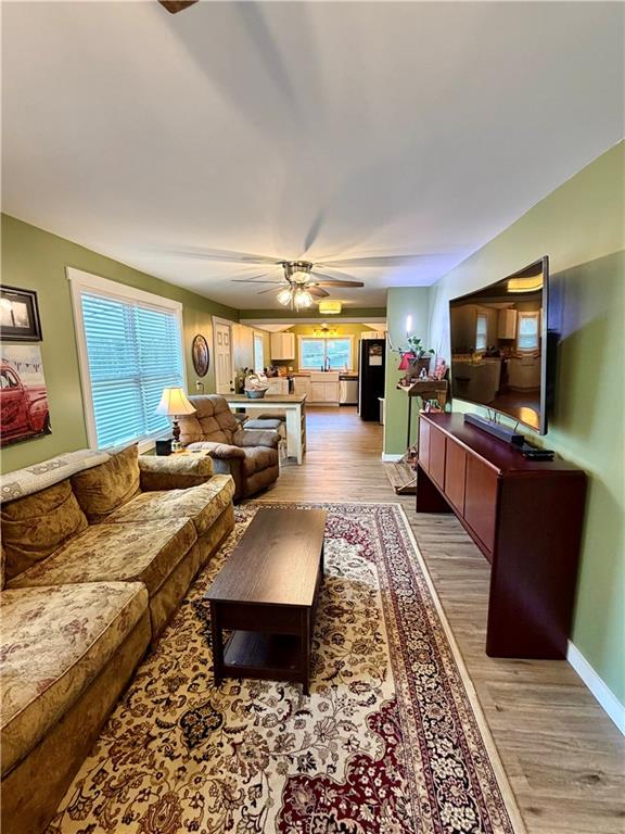 525 Wildcat Bridge Road Royston, GA 30662 - Photo 8 of 26 a living room with furniture and a flat screen tv