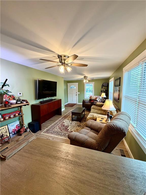 525 Wildcat Bridge Road Royston, GA 30662 - Photo 9 of 26 a living room with furniture and a flat screen tv