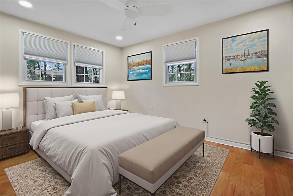 2 Constitution Way, Unit C Methuen, MA 01844 - Photo 12 of 14 a bedroom with a large bed and a potted plant