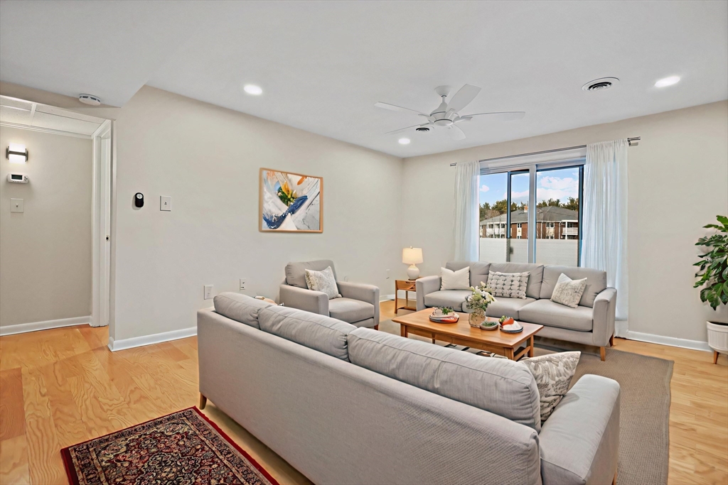 2 Constitution Way, Unit C Methuen, MA 01844 - Photo 4 of 14 a living room with furniture and a window